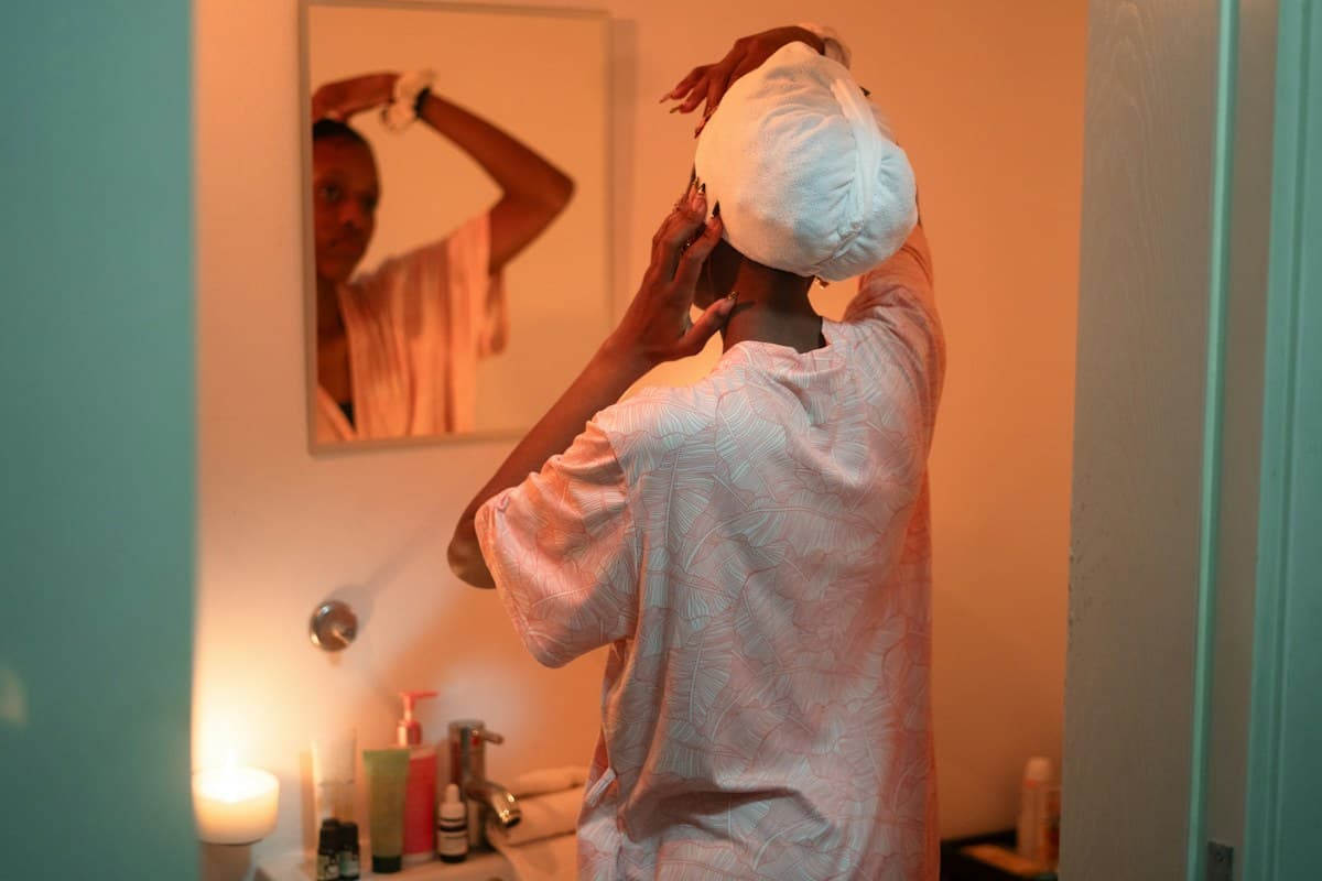Woman caring for her hair during a self-care routine
